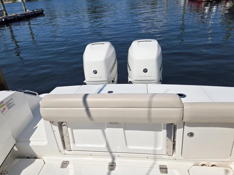 Slide: The Image of 2017 Boston Whaler 330 Outrage boat with twin engines at dock. - 14