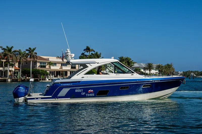 Slide: The Image of 2021 Formula 380 Super Sport Crossover OB boat cruising on a sunny day. - 0