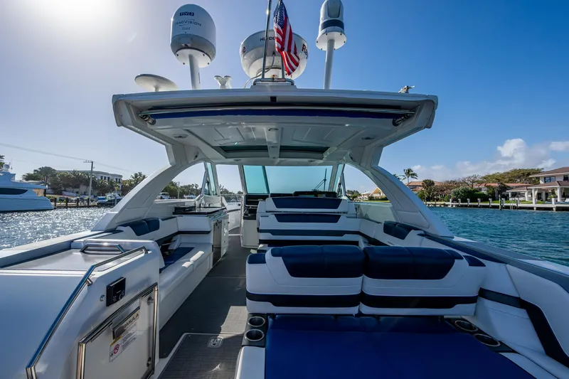 Slide: The Image of 2021 Formula 380 Super Sport Crossover OB boat on sunny waterfront. - 1