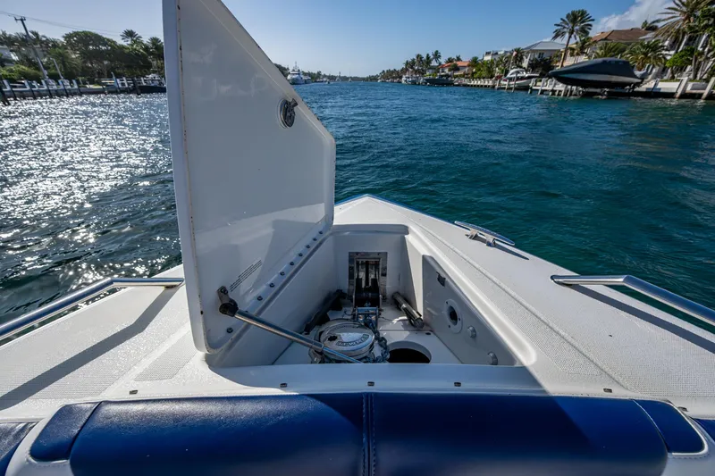 Slide: The Image of 2021 Formula 380 Super Sport Crossover OB boat on scenic waterway. - 11