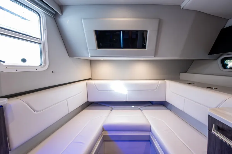 Slide: The Image of 2021 Formula 380 Super Sport Crossover OB interior with modern seating and ambient lighting. - 15