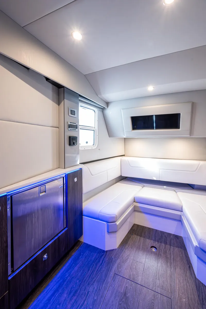 Slide: The Image of 2021 Formula 380 Super Sport Crossover OB interior with modern seating and ambient lighting. - 16