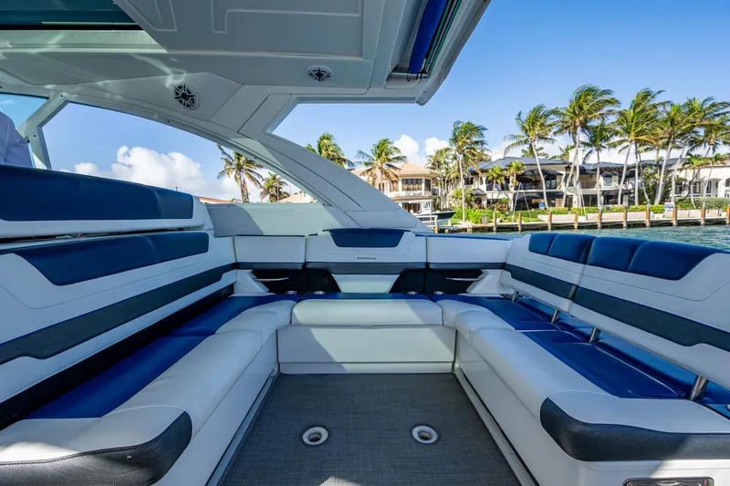 Slide: The Image of 2021 Formula 380 Super Sport Crossover OB interior with luxurious seating and ocean view. - 23