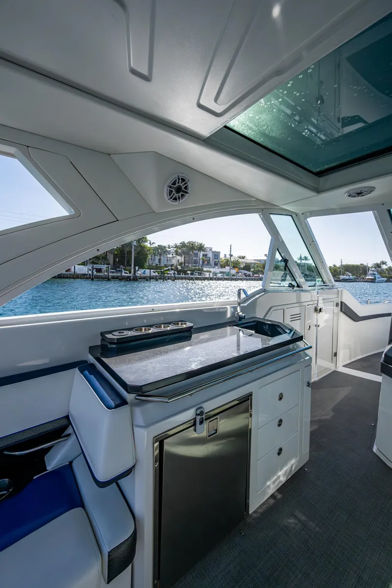 Slide: The Image of 2021 Formula 380 Super Sport Crossover OB interior with sleek design and waterfront view. - 25