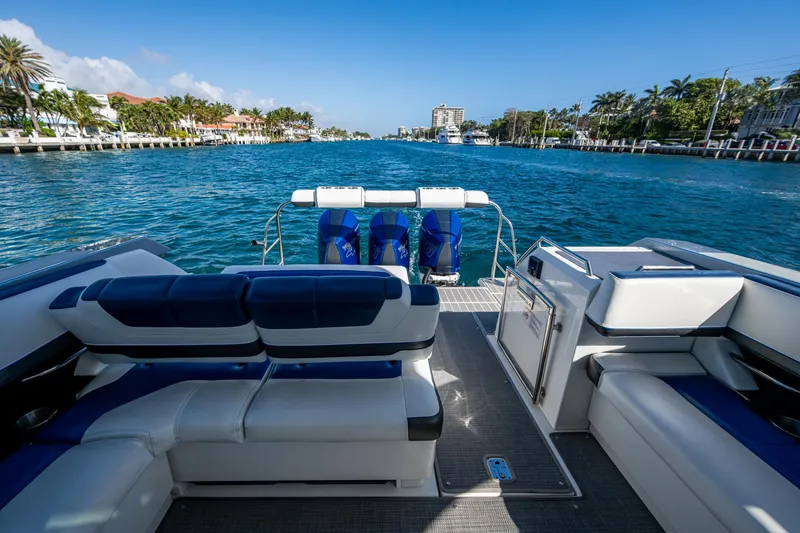 Slide: The Image of 2021 Formula 380 Super Sport Crossover OB on scenic waterway, luxury seating, and outboard motors. - 26