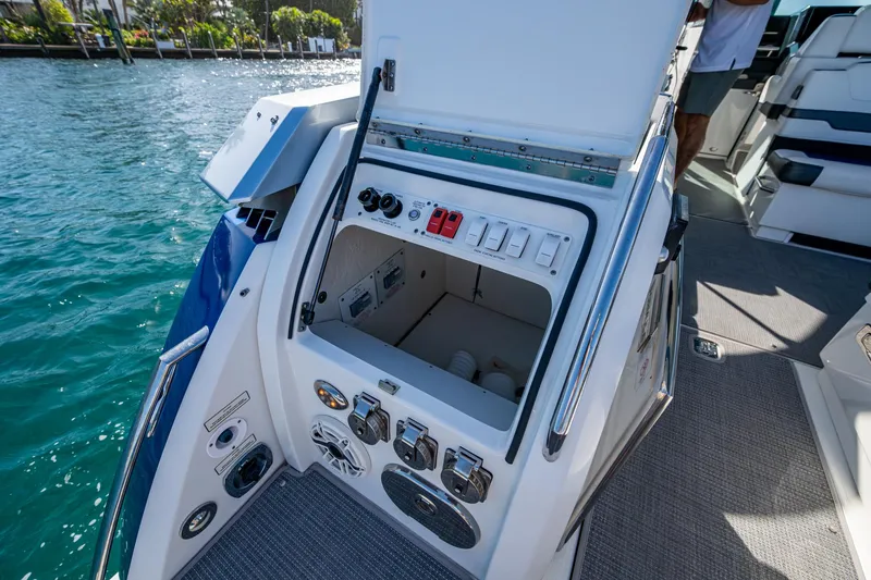 Slide: The Image of 2021 Formula 380 Super Sport Crossover OB boat control panel by the water. - 29