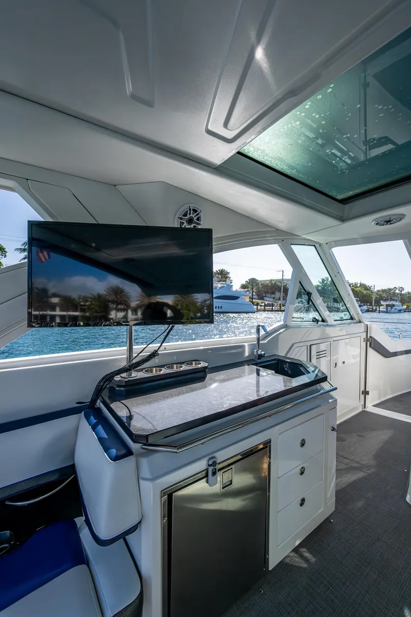 Slide: The Image of 2021 Formula 380 Super Sport Crossover OB interior with TV and kitchenette. - 31