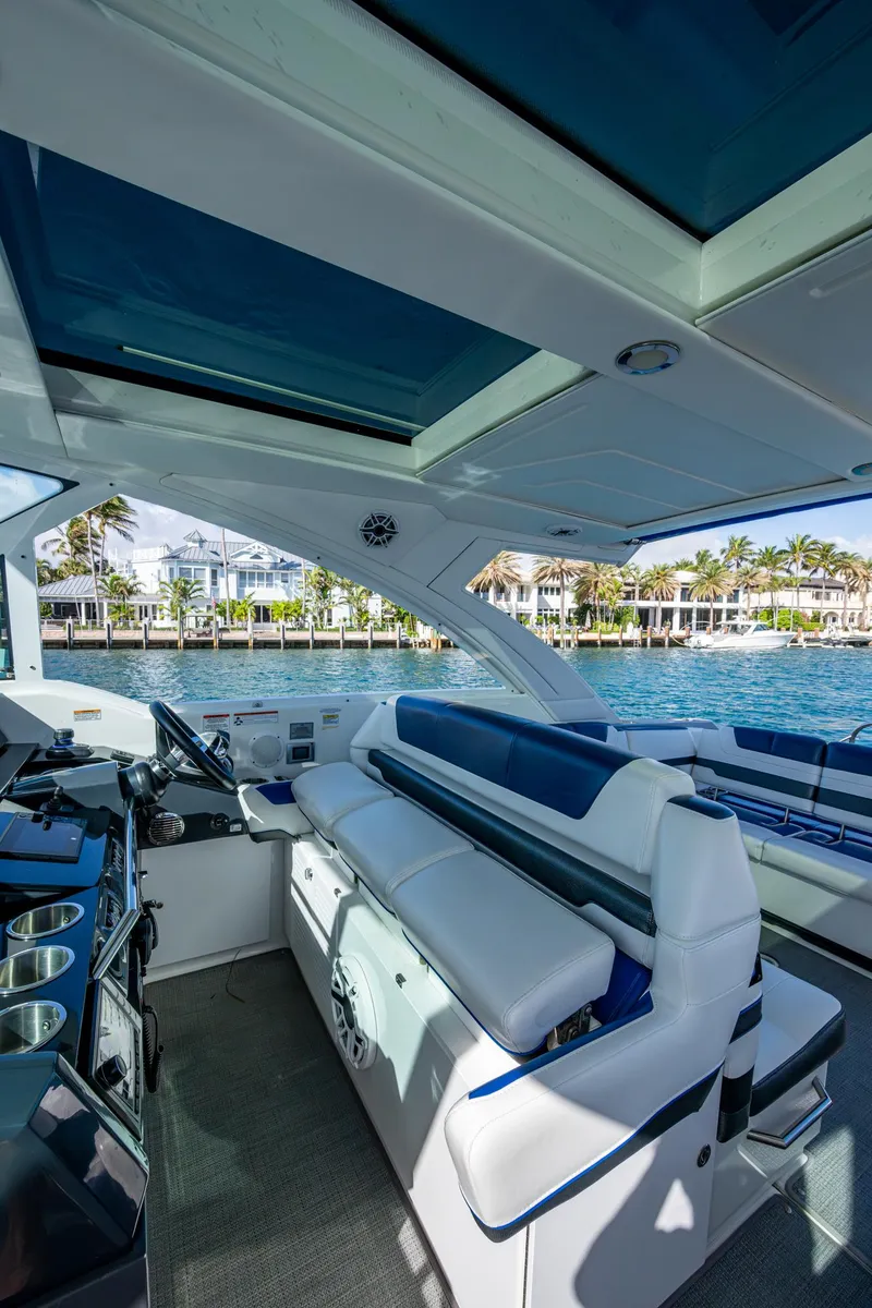 Slide: The Image of 2021 Formula 380 Super Sport Crossover OB interior with luxurious seating and waterfront view. - 35
