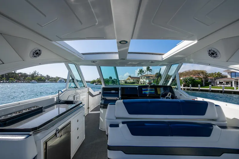 Slide: The Image of 2021 Formula 380 Super Sport Crossover OB interior with luxurious seating and panoramic water views. - 45