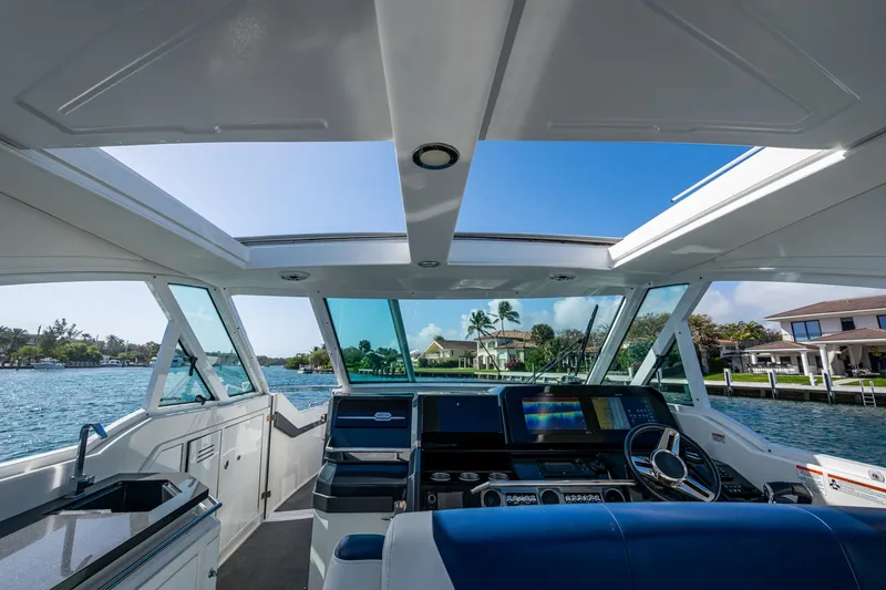 Slide: The Image of 2021 Formula 380 Super Sport Crossover OB cockpit with panoramic water view. - 46