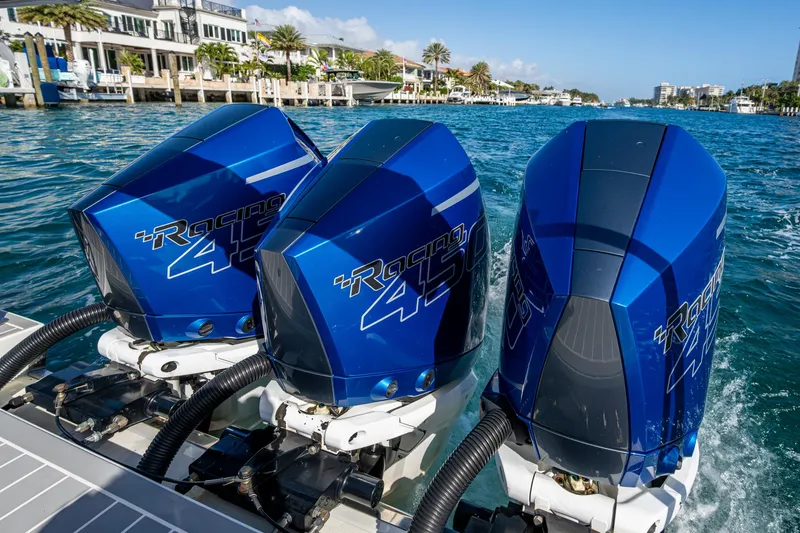 Slide: The Image of Triple blue outboard motors on a 2021 Formula 380 Super Sport Crossover OB boat. - 47