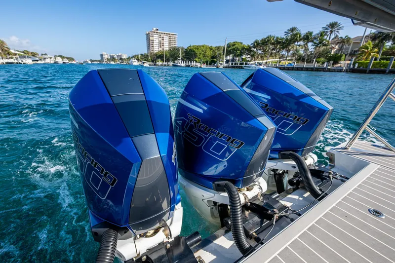 Slide: The Image of 2021 Formula 380 Super Sport Crossover OB with triple outboard engines on blue water. - 48