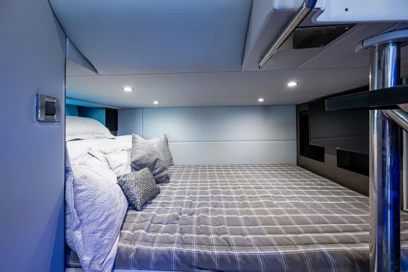 Slide: The Image of 2021 Formula 380 Super Sport Crossover OB cabin interior with cozy bedding and modern lighting. - 5