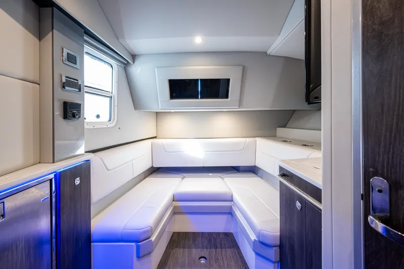 Slide: The Image of 2021 Formula 380 Super Sport Crossover OB interior with modern seating and ambient lighting. - 8
