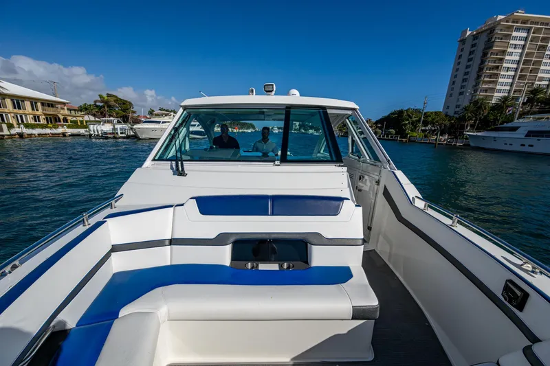 Slide: The Image of 2021 Formula 380 Super Sport Crossover OB on water, showcasing sleek design and luxury features. - 9