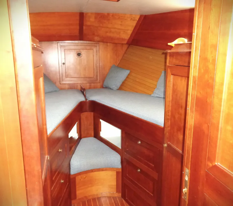 Slide: The Image of Interior of 1990 Pettegrow 36 Flybridge with wooden cabinetry and twin beds. - 5