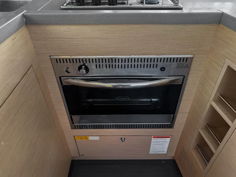 Slide: The Image of Modern kitchen oven in a 2017 Lagoon 450 F yacht galley. - 31