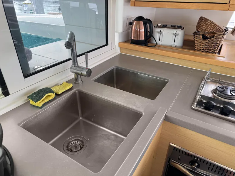 Slide: The Image of Modern kitchen sink and countertop on a 2017 Lagoon 450 F catamaran. - 32