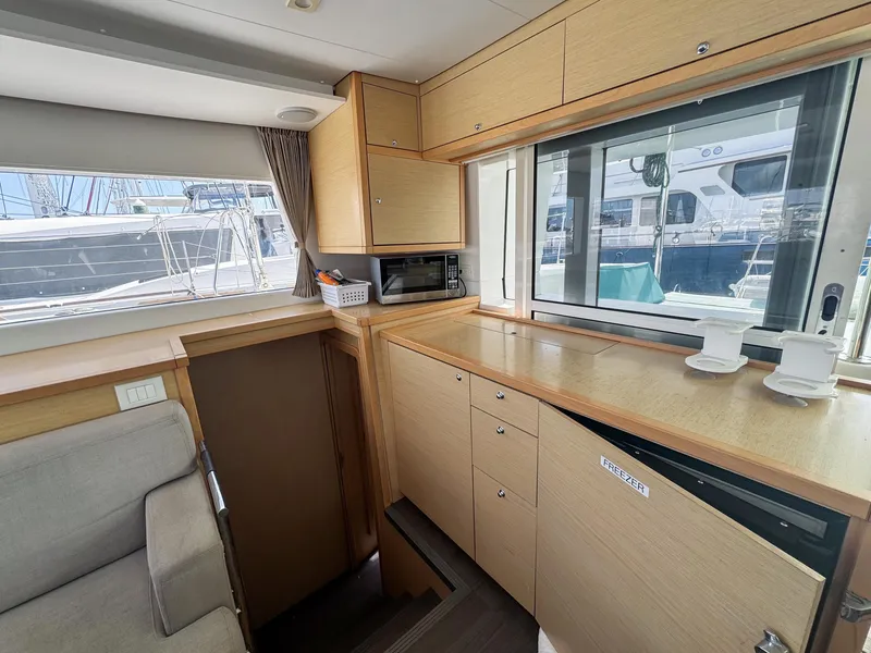 Slide: The Image of Interior of 2017 Lagoon 450 F catamaran with modern kitchen and ample storage. - 34