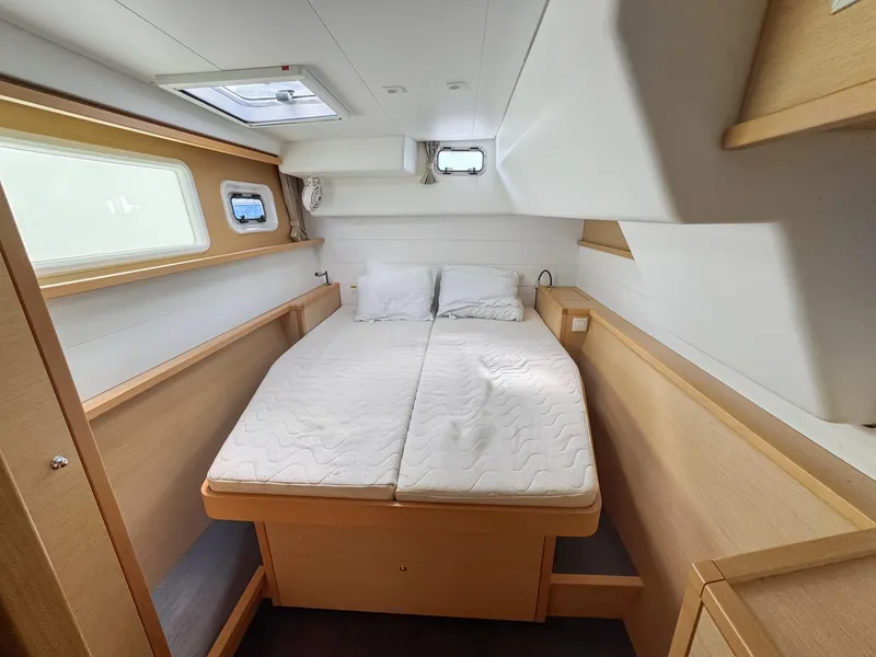 Slide: The Image of 2017 Lagoon 450 F cabin interior with double bed and natural light. - 37