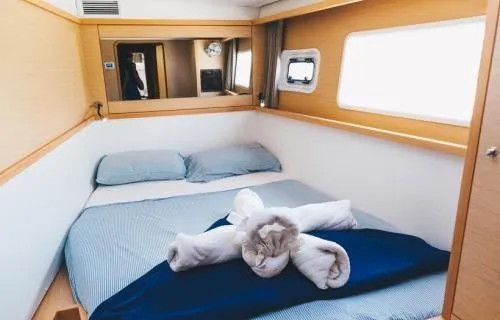Slide: The Image of Cozy bedroom in 2017 Lagoon 450 F yacht with neatly arranged towels. - 39