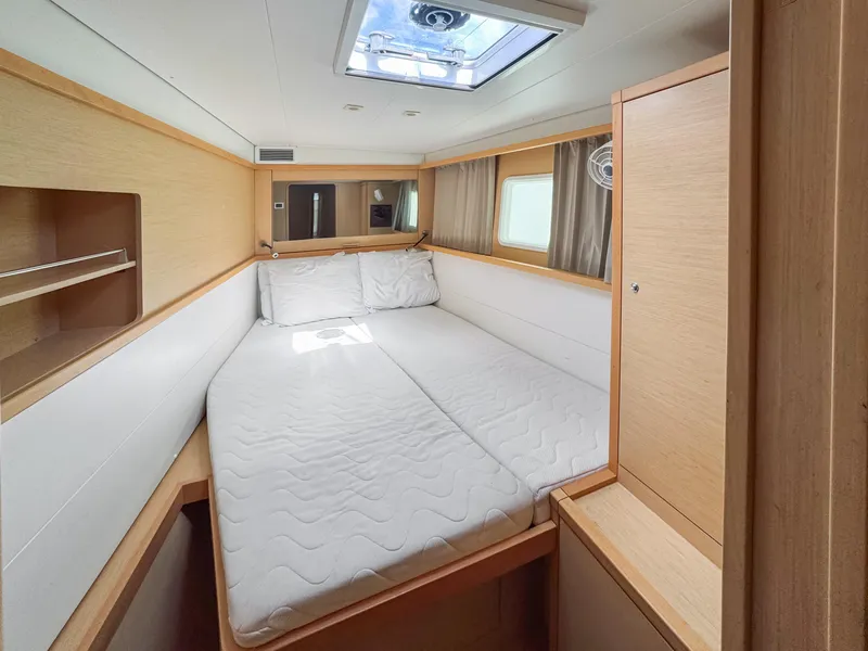 Slide: The Image of Luxurious cabin interior of 2017 Lagoon 450 F catamaran with comfortable bed and natural light. - 40