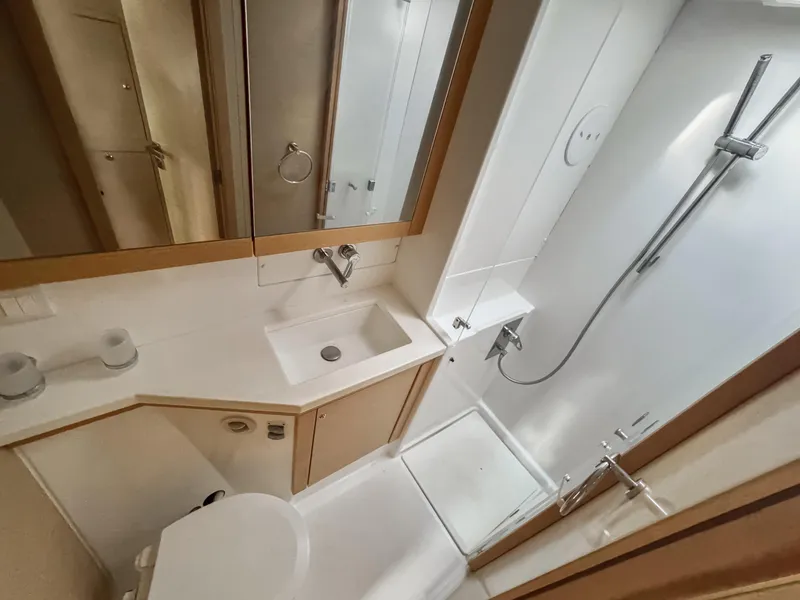 Slide: The Image of Bathroom interior of 2017 Lagoon 450 F yacht, featuring sink, toilet, and shower. - 43