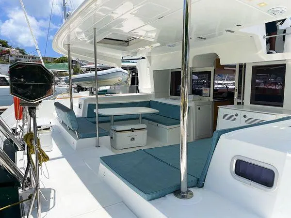 Slide: The Image of 2017 Lagoon 450 F catamaran with spacious outdoor seating and modern design. - 5