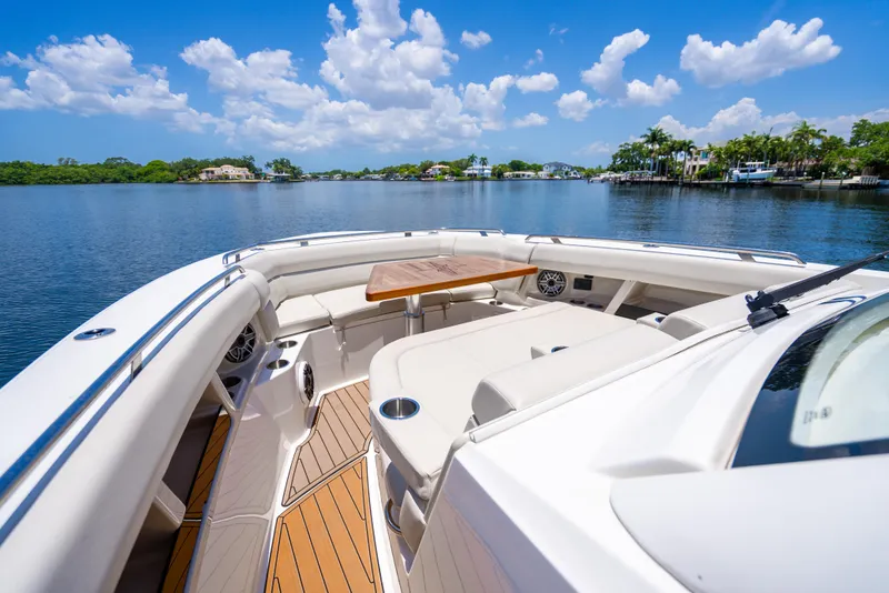 Slide: The Image of 2021 Boston Whaler 350 Realm boat with spacious deck and scenic water view. - 16