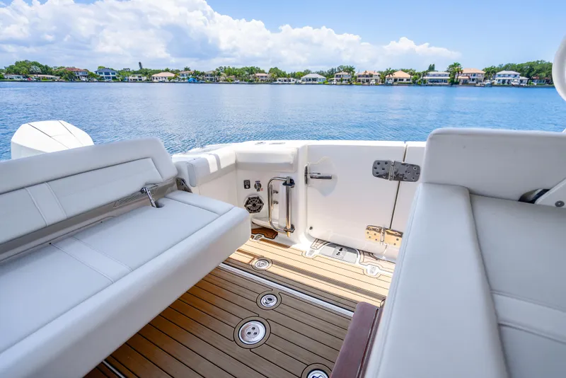 Slide: The Image of Boston Whaler 350 Realm 2021 boat interior with seating and scenic water view. - 32