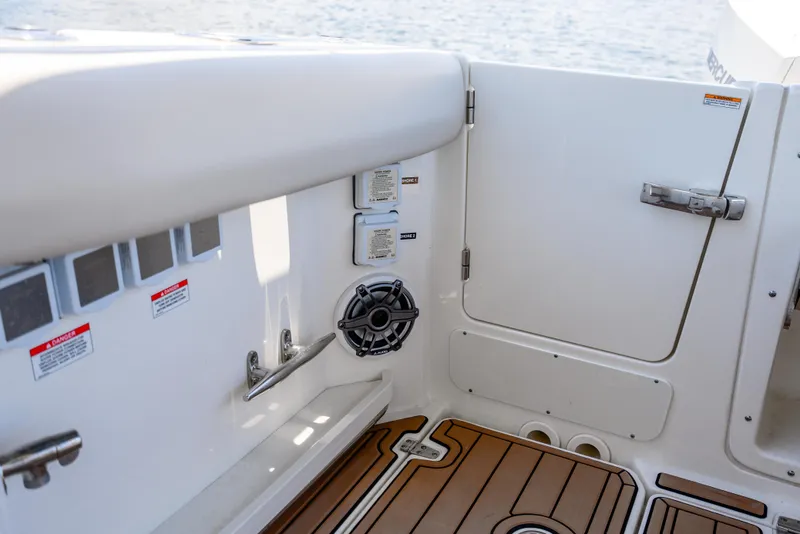 Slide: The Image of Interior view of 2021 Boston Whaler 350 Realm boat, featuring sleek design and wood flooring. - 33