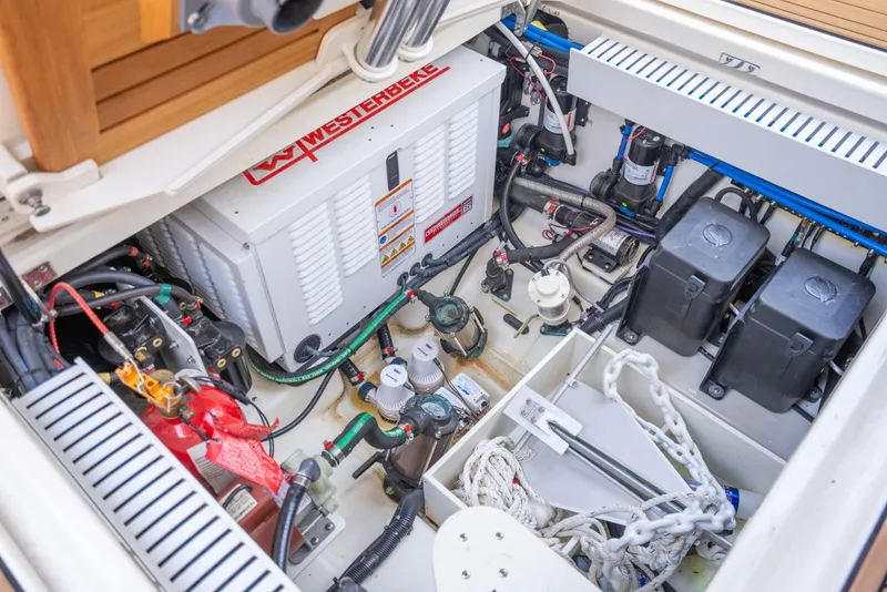 Slide: The Image of 2021 Boston Whaler 350 Realm engine compartment with equipment and wiring. - 39