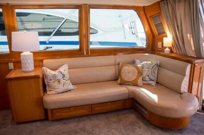Slide: The Image of Luxurious interior of 2005 McKinna 57 Pilothouse yacht with plush seating and decorative pillows. - 6