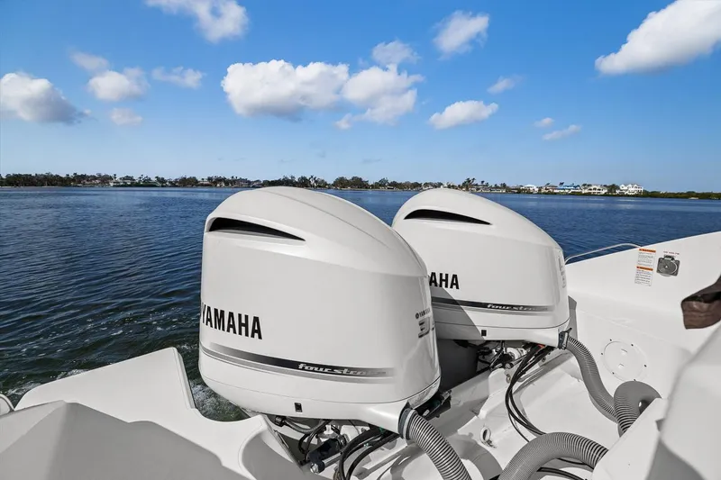 Slide: The Image of 2021 Pursuit S 328 Sport boat with twin Yamaha outboard engines on a sunny day. - 31