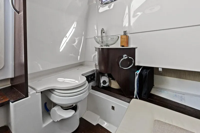 Slide: The Image of 2021 Pursuit S 328 Sport boat interior bathroom with modern fixtures and compact design. - 37