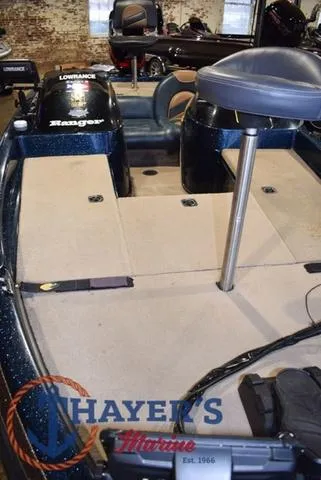 Slide: The Image of 2000 Ranger R83 boat interior with seating and equipment, displayed at Thayer's Marine. - 10