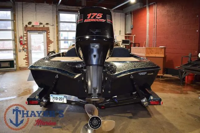 Slide: The Image of Ranger R83 boat with Mercury 175 engine in a garage, 2000 model. - 11