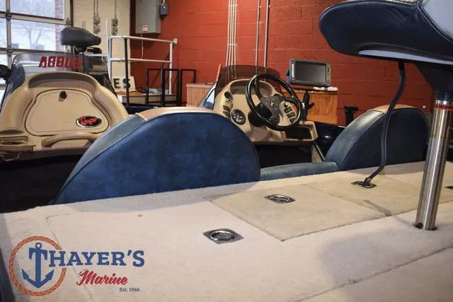 Slide: The Image of Interior of a 2000 Ranger R83 boat at Thayer's Marine showroom. - 13