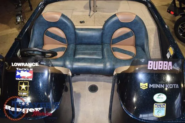 Slide: The Image of Interior of a 2000 Ranger R83 boat with dual seats and branded decals. - 18