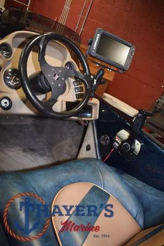 Slide: The Image of Interior of a 2000 Ranger R83 boat with steering wheel and navigation system. - 21