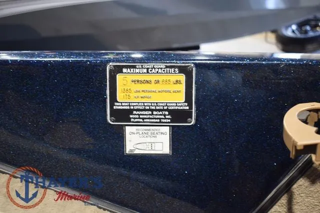 Slide: The Image of Capacity label on 2000 Ranger R83 boat, showing maximum weight and passenger limits. - 24