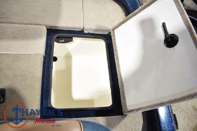 Slide: The Image of Open storage compartment in a 2000 Ranger R83 boat interior. - 26