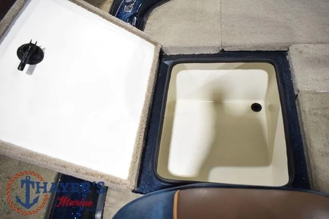 Slide: The Image of Open storage compartment in a 2000 Ranger R83 boat interior. - 28