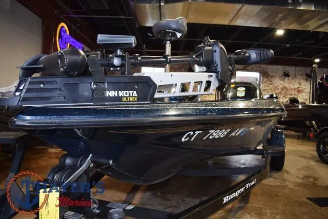 Slide: The Image of 2000 Ranger R83 boat with Minn Kota Ultrex motor displayed indoors. - 3