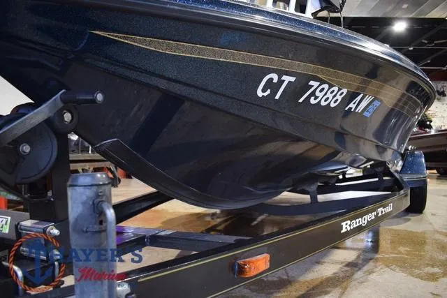 Slide: The Image of 2000 Ranger R83 boat on trailer, registration CT 7988 AW, displayed indoors. - 35