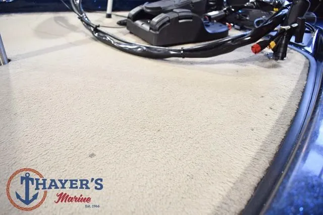 Slide: The Image of 2000 Ranger R83 boat deck with Thayer's Marine logo, featuring control cables and equipment. - 37