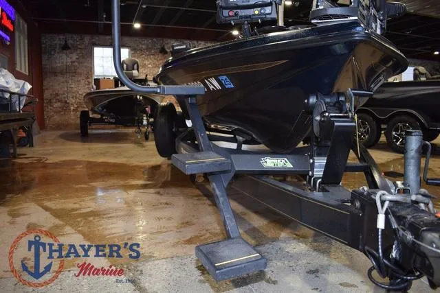 Slide: The Image of 2000 Ranger R83 boat on trailer at Thayer's Marine showroom. - 4