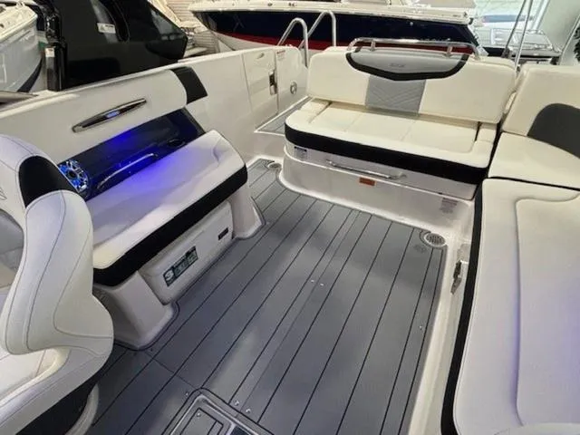 Slide: The Image of 2024 Chaparral 287 SSX boat interior with sleek seating and modern design. - 14