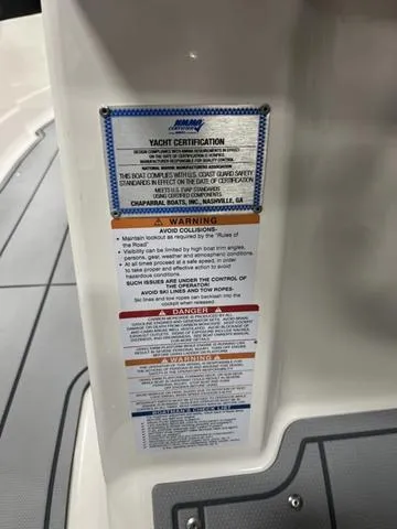 Slide: The Image of 2024 Chaparral 267 SSX yacht certification and safety warning label. - 12