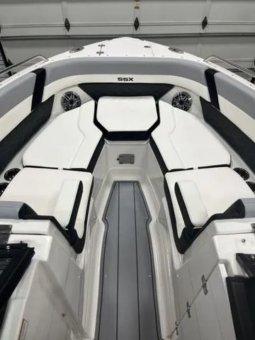 Slide: The Image of 2024 Chaparral 267 SSX boat interior with sleek seating and modern design. - 14